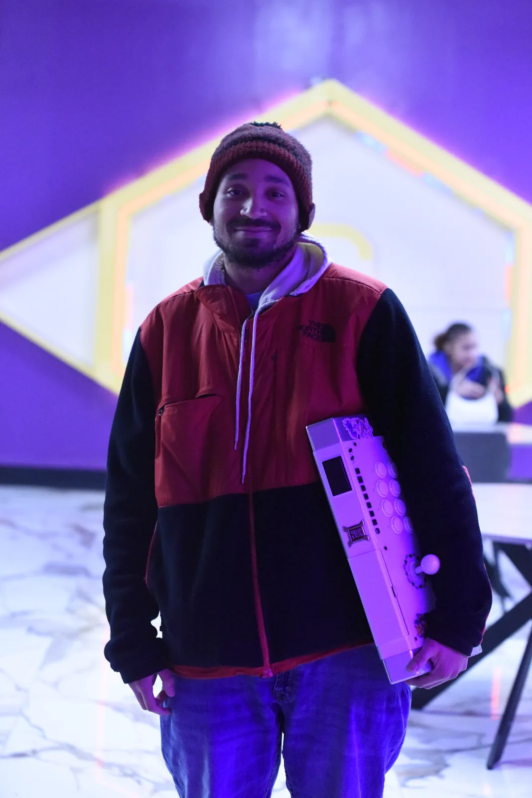Olympus team member in front of the hex wall