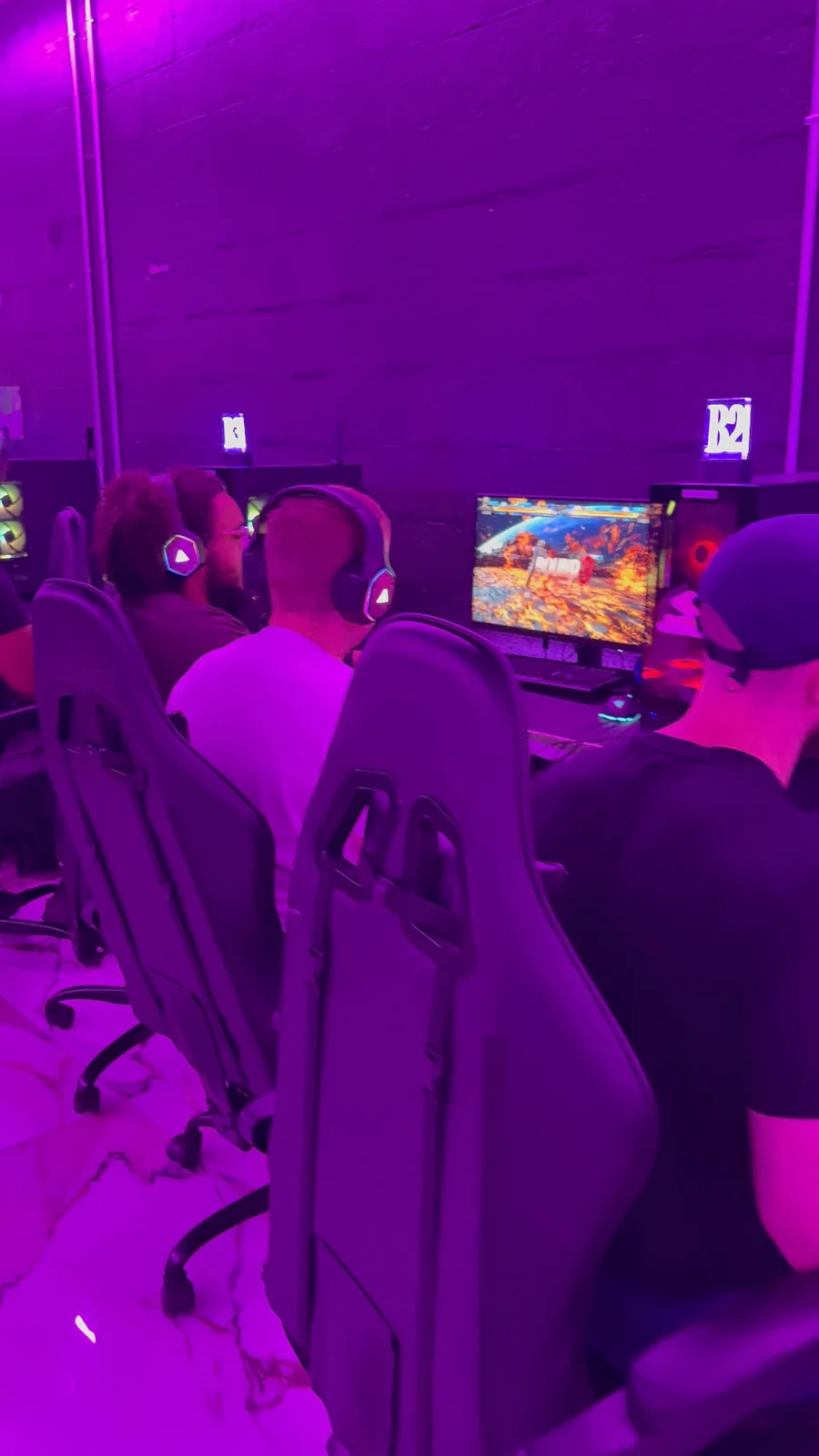 Players at consoles on tournament day