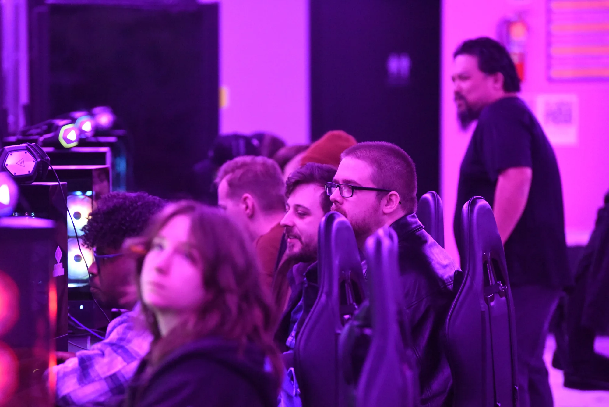 Adults watching a tournament match