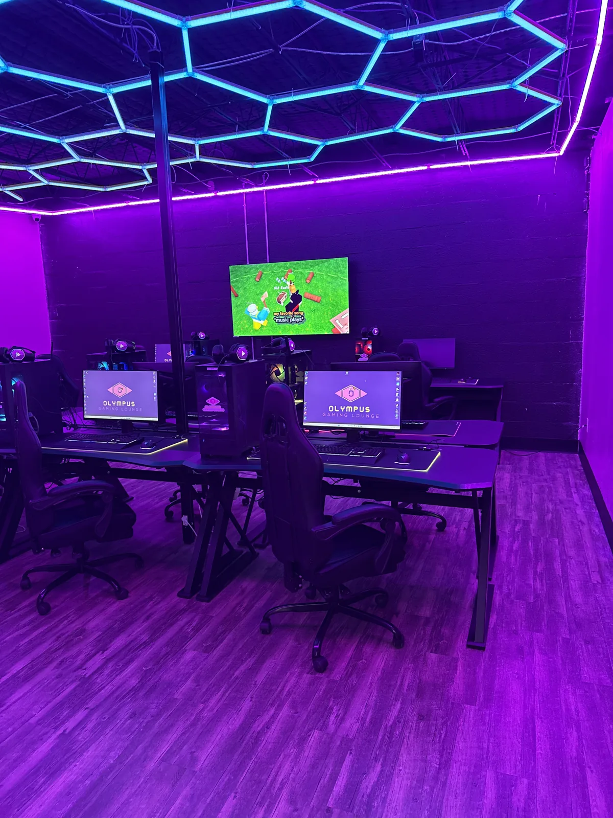 Gaming PC stations under hexagon LED lighting