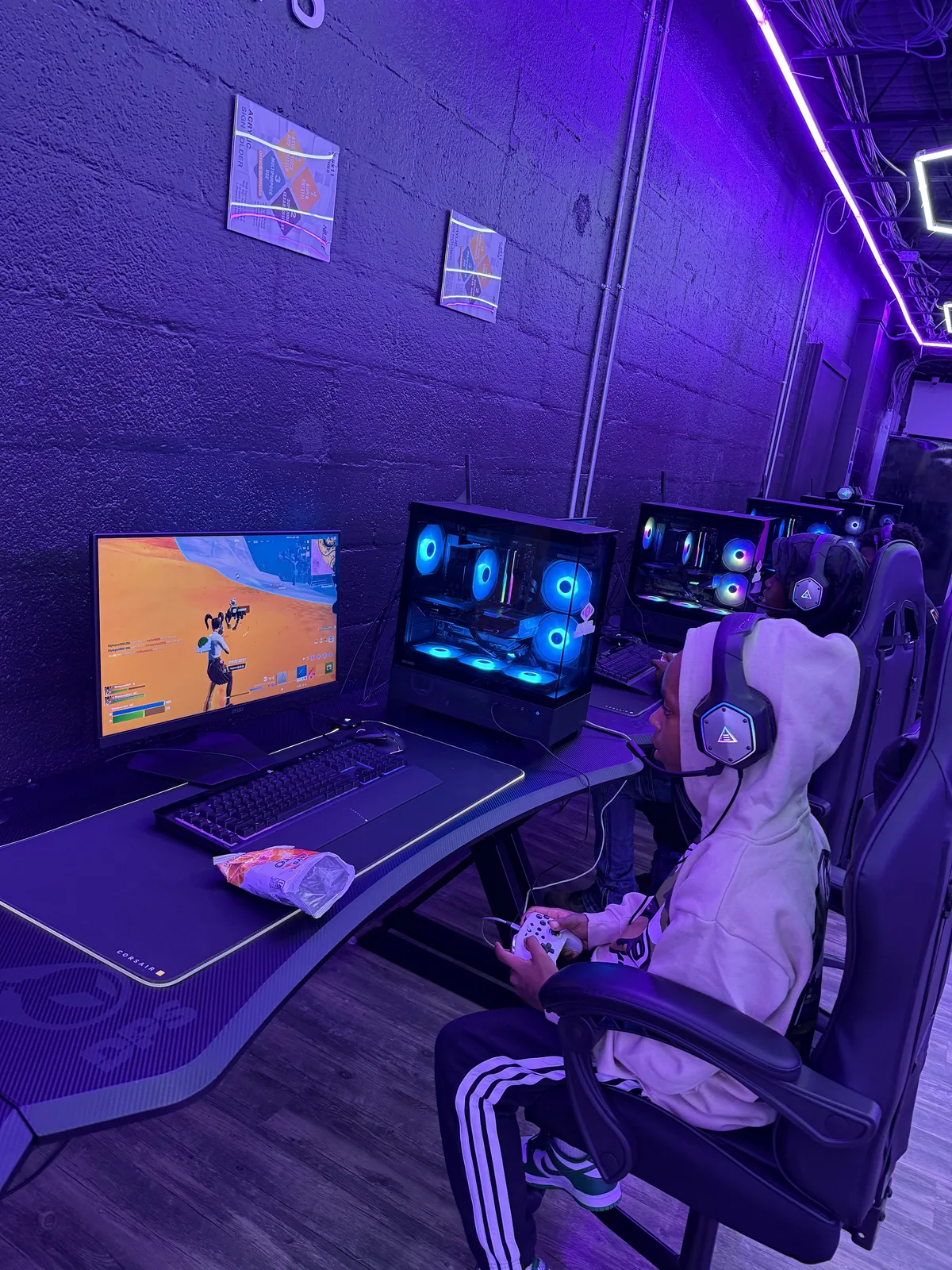 Player at a PC station playing Fortnite